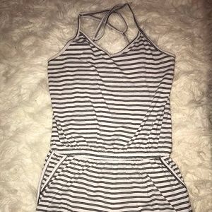Small v neck striped romper with pockets.